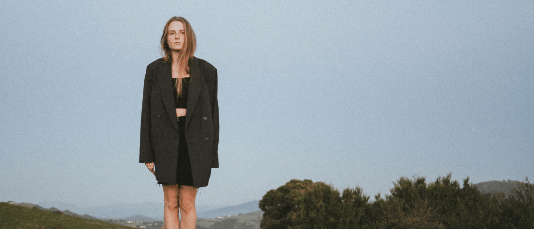 Woman under open sky symbolizing the power of creativity and inner clarity