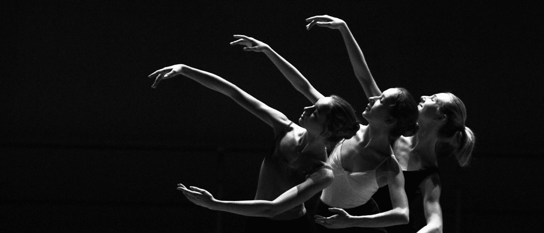 Three ballet dancers in sync, embodying flow, grace, and creative movement